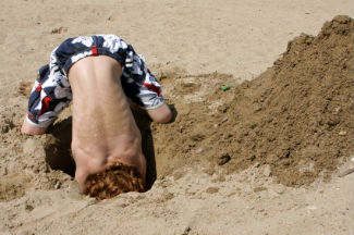 Boy digging a hole