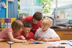 Kids reading a comic book in school